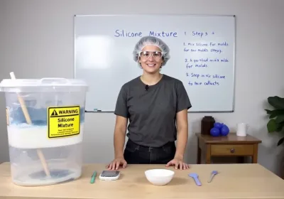 Mixing silicone for molds showing a person pouring silicone into a bowl.