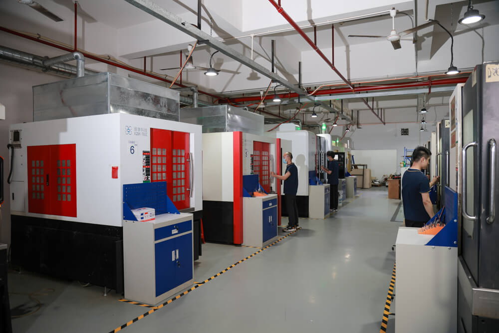 Row of CNC machining centers inside the LKprototype workshop